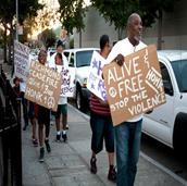 Pastor Donnell Jones leads Ceasefire peace walk through Richmond. (Photo by: Sara Lafleur Vetter)